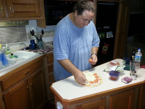 Eric making pizza