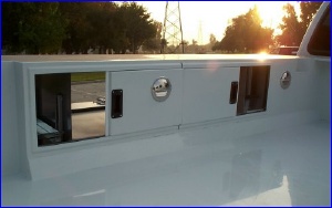 Sliding panels allow access from within the camper